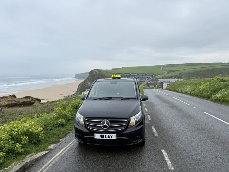 Black Mercedes-Benz Newquay Cab parked on Watergate Road, providing premium taxi services to Watergate Bay and the Watergate Bay Hotel