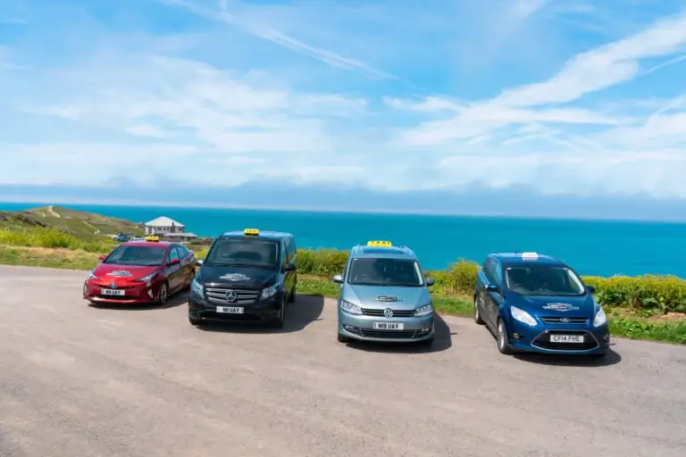 Newquay Cab fleet parked at Lewinnick Lodge for a selfie.